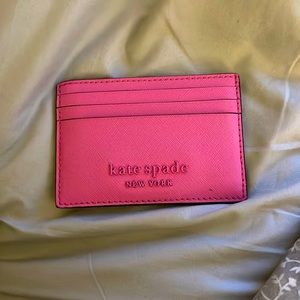 Pink Kate Spade card holder.